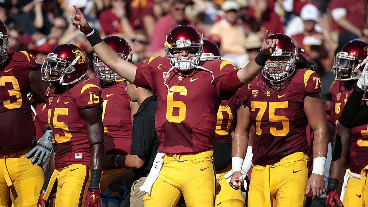 USC quarterback Cody Kessler celebrates after throwing a touchdown pass during a win over Colorado on Oct. 18. Kessler will be back for his senior season with the Trojans.