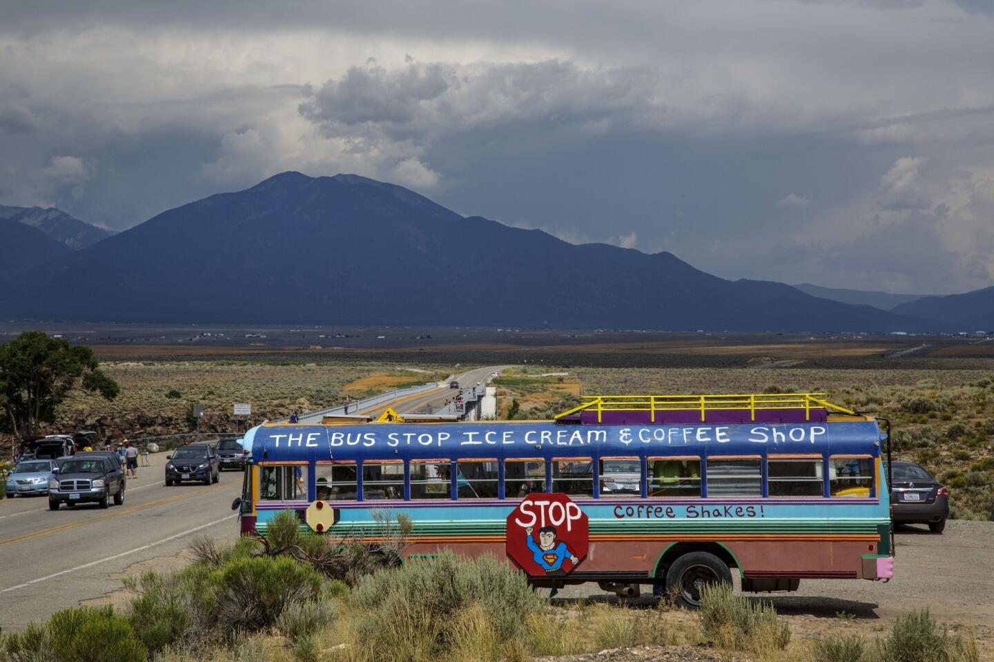 The Bus Stop Ice Cream & Coffee Shop sells goods by the bridge that crosses the Rio Grande Gorge in Taos. The New Mexico city has been an oasis for people looking to escape since the early 1900s.