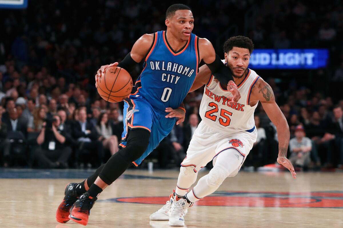 Thunder guard Russell Westbrook (0) drives to the basket past Knicks guard Derrick Rose (25) during the first half on Nov. 28.
