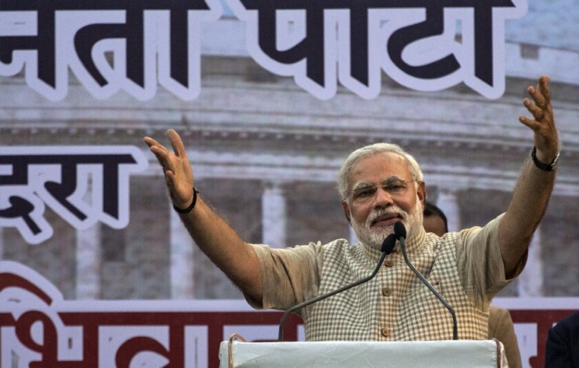Indian Prime Minister-designate Narendra Modi gestures while speaking to supporters on Friday after his landslide victory.