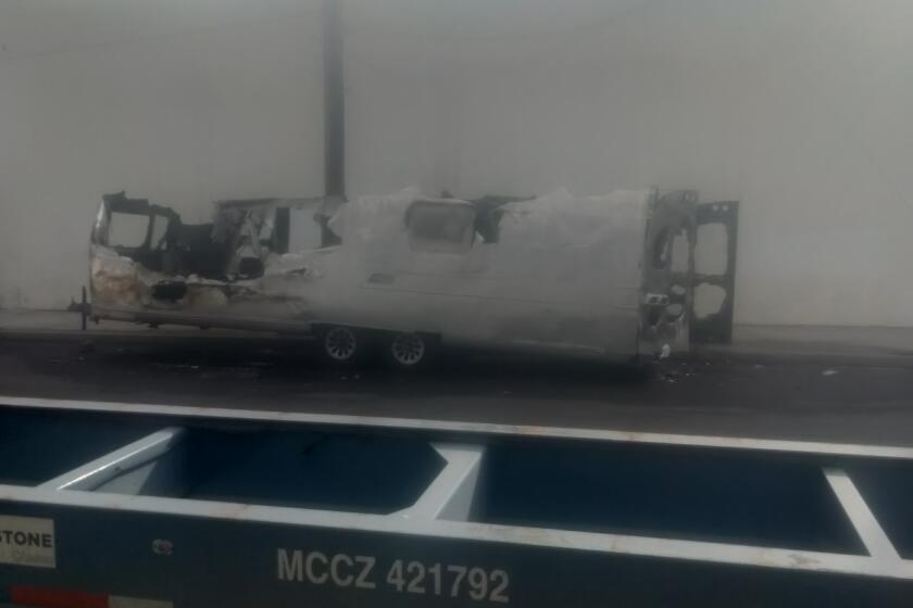 A stripped and burned out Airstream trailer once containing a plane, four engines, tools and parts was found in Long Beach.