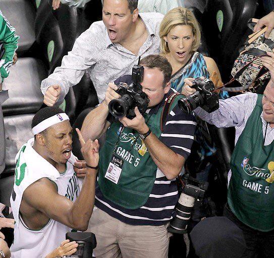 Celtics forward Paul Pierce, who finished with a team-high 27 points, declares to fans "one more win" for an NBA title after Boston defeated the Lakers, 92-86, in Game 5 on Sunday to take a 3-2 lead in the best-of-seven NBA Finals.