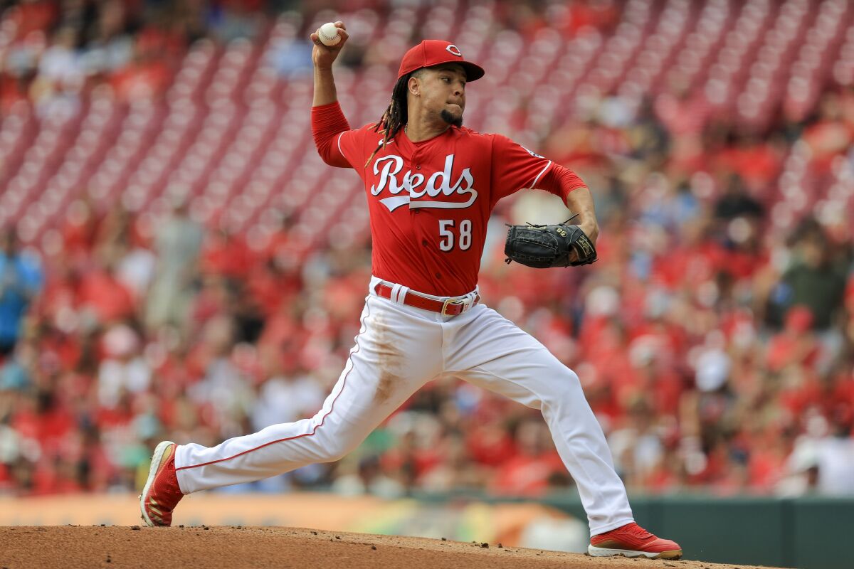 Cincinnati Reds' Luis Castillo throws during the first inning of a baseball game against the Minnesota Twins in Cincinnati, Wednesday, Aug. 4, 2021. (AP Photo/Aaron Doster)