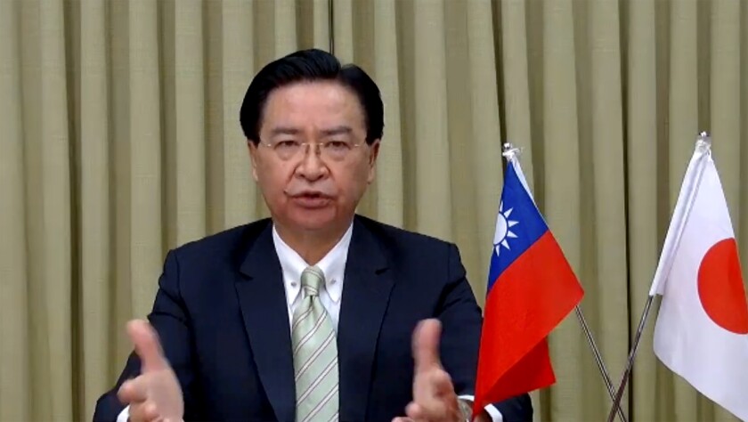 In this image from video released by Foreign Correspondents' Club of Japan, Taiwan Foreign Minister Joseph Wu attends a remote press conference with Foreign Correspondents Club of Japan in Tokyo, Thursday, June 3, 2021. Wu on Thursday said China is seeking political gains abroad in return for providing vaccines and other pandemic assistance, partly to increase pressure on Taiwan, which it claims as its own territory. (FCCJ via AP)