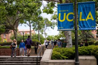 Los Angeles, CA - May 17: Signage and people along Bruin Walk East, on the UCLA Campus in Los Angeles, CA, Wednesday, May 17, 2023. (Jay L. Clendenin / Los Angeles Times)