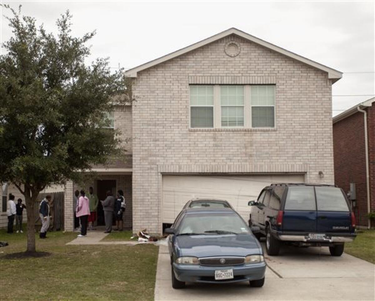 The Cypress, Texas, home where shooting erupted during a birthday party, leaving two dead and 19 hurt. Two young men were arrested, but charges against one have been dropped.