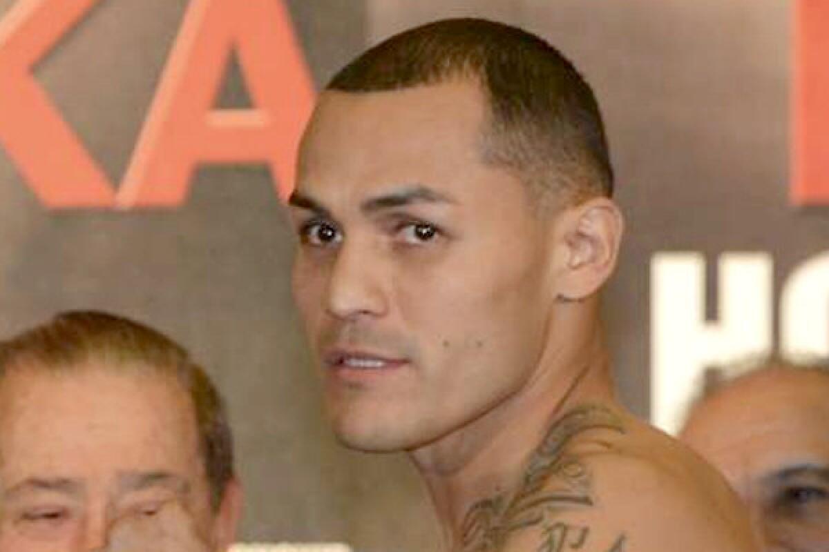 The manager-trainer for Mike Alvarado, above, says the boxer is planning to come to Los Angeles to train for a May fight.