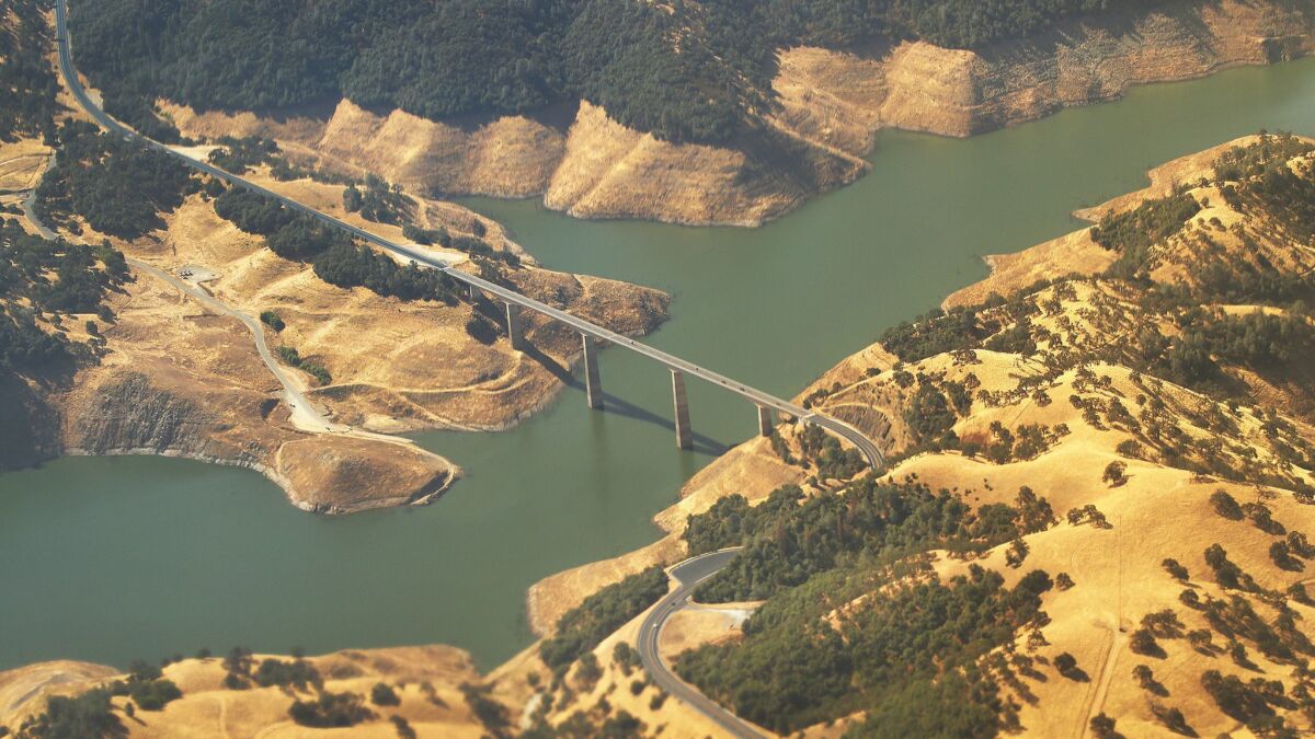 In a lawsuit, the federal government says California's new flow standards for the Stanislaus River will interfere with operation of the New Melones Dam and reservoir.