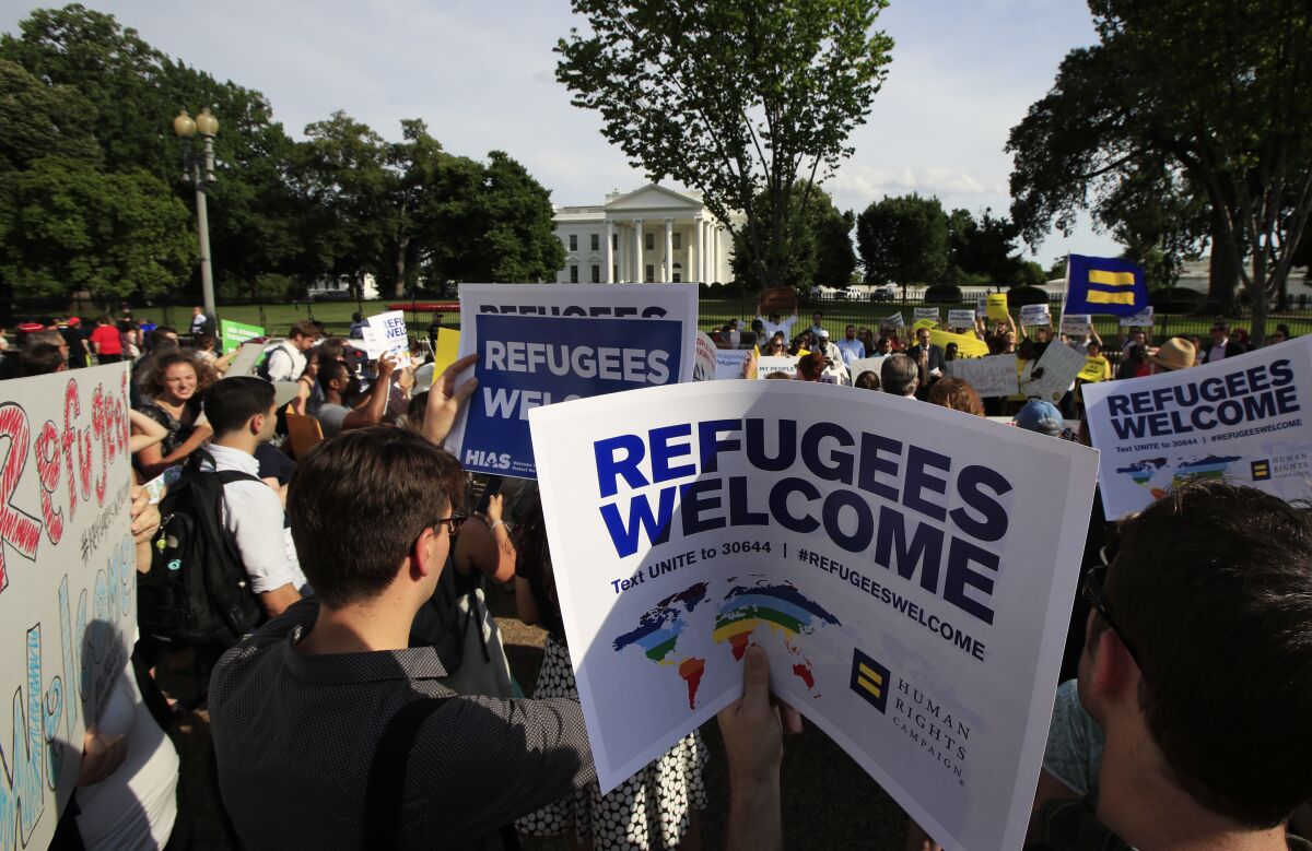  In this June 20, 2017 file photo, Refugees and community activists gather in front of the White House.