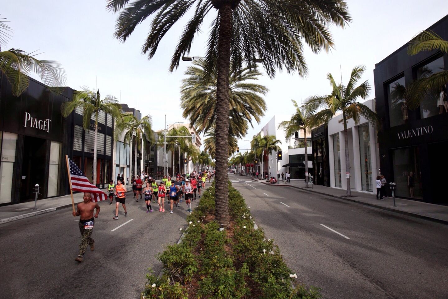 Runners make their way along Rodeo Drive, in Beverly Hills during the 30th Los Angeles Marathon
