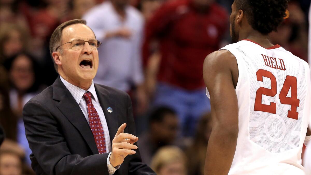 Oklahoma Coach Lon Kruger talks to guard Buddy Hield during an NCAA tournament game against VCU on March 20.