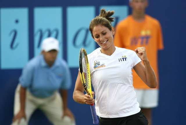 The Newport Beach Breakers' Marie-Eve Pelletier celebrates after she and Travis Rettenmaier beat St. Louis Aces' Liezel Huber and Jean-Julien Rojer during a World Team Tennis mixed doubles match.