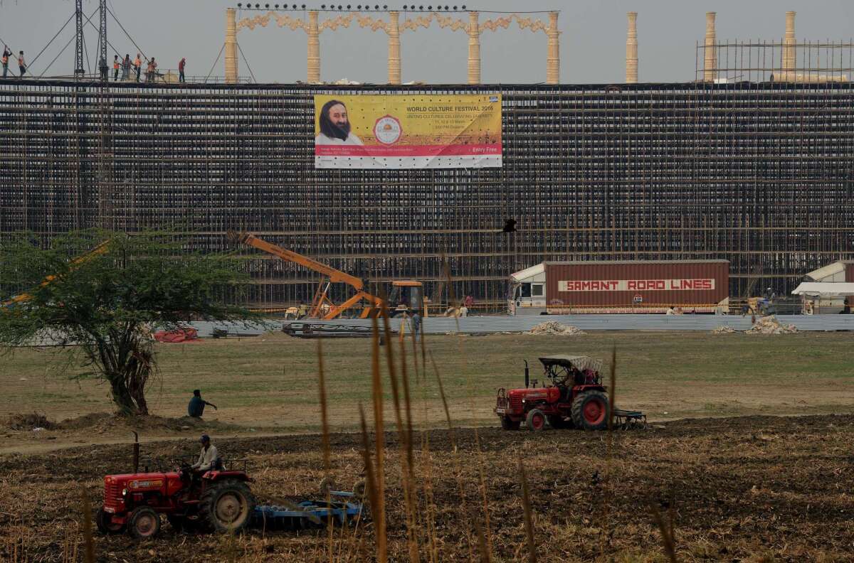 Laborers take part in construction work on the banks of the Yamuna River in New Delhi on March 1.
