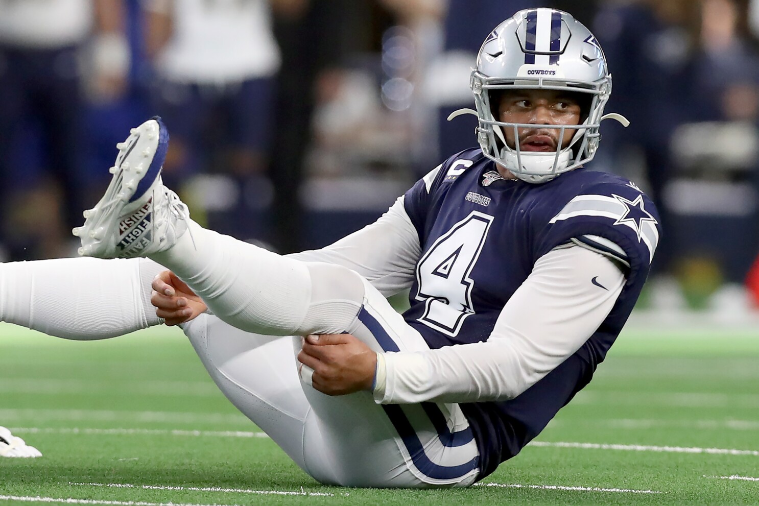 Dak prescott is carted off the field after sustaining an ankle injury. 