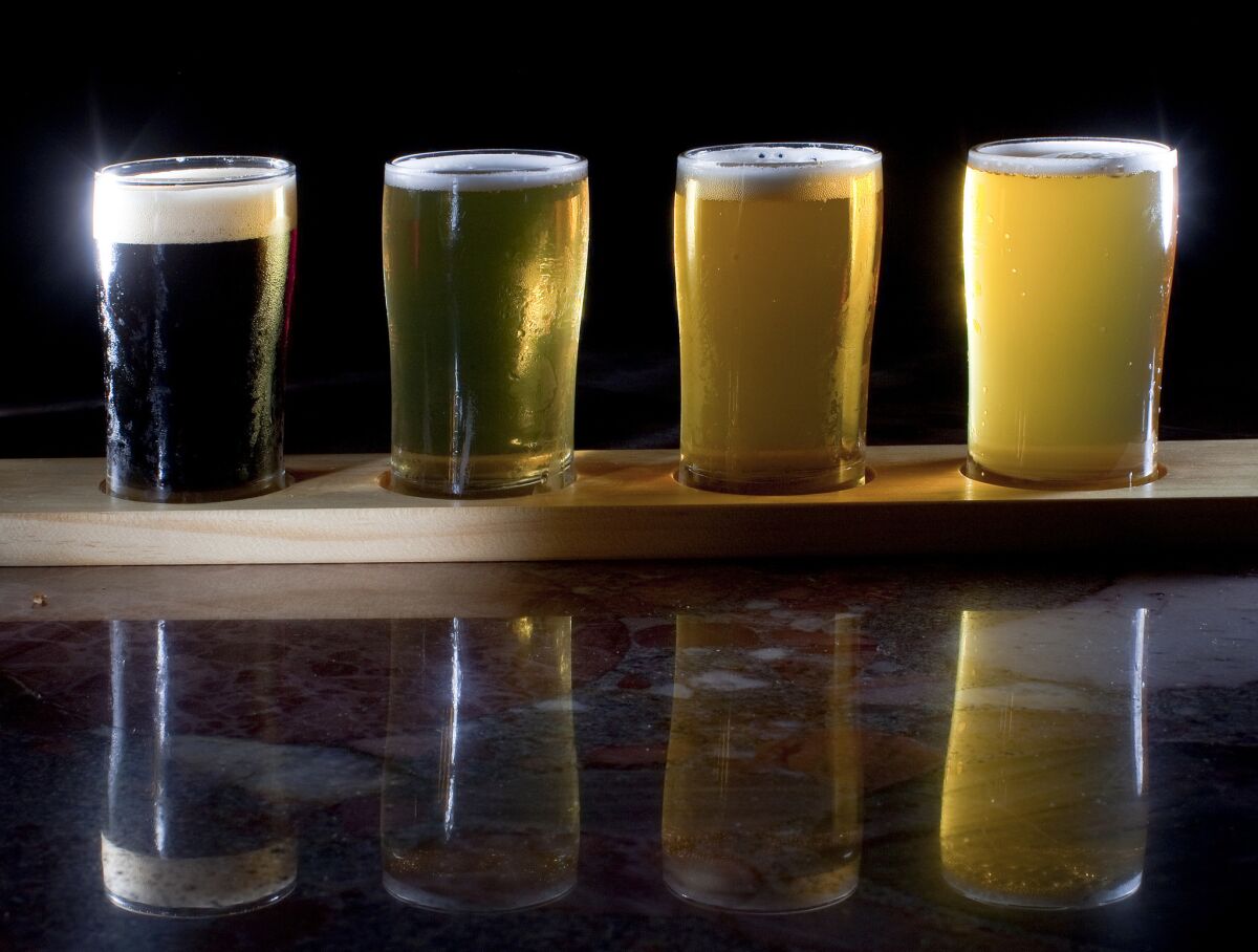 A taster flight of beer from Eagle Rock Brewery is shown. A new California law will allow breweries to give free samples of beer at farmers markets next year.