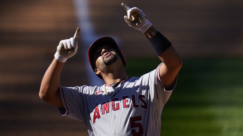 Albert Pujols gestures during a game.
