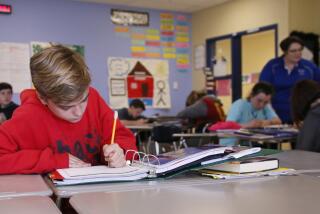 Hudson Hites works on sentence diagramming in Terri Foughty's seventh grage English class in Newcastle, Okla, Thursday, March 30, 2017. Fought is at right. Newcastle Public Schools have moved to a four day school week in response to Oklahoma's Budget Woes. (AP Photo/Sue Ogrocki)
