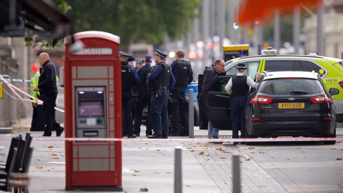 Police at the scene of an incident outside the Natural History Museum in London on Saturday.