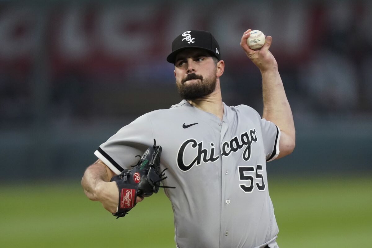 Chicago White Sox starting pitcher Carlos Rodon throws during the first inning of the team's baseball game against the Kansas City Royals on Friday, May 7, 2021, in Kansas City, Mo. (AP Photo/Charlie Riedel)