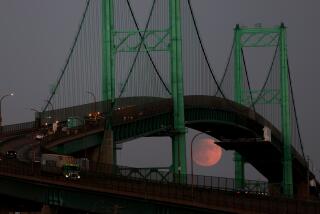 San Pedro, California September 17, 2024-The Harvest moon rises over the Vincent Thomas Bridge in San Pedro Tuesday night. Wally Skalij/Los Angeles Times)