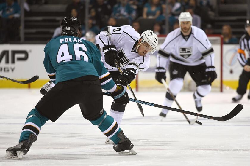 Kings forward Tanner Pearson (70) passes the puck up ice past Sharks defenseman Roman Polak (46) in the first period of Game 3.
