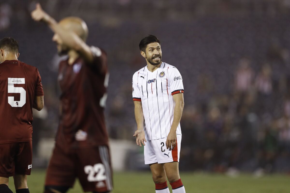 Chivas forward Oribe Peralta, right, reacts during the second half of a Colossus Cup soccer match against River Plate Friday, June 28, 2019, in San Diego. (AP Photo/Gregory Bull)
