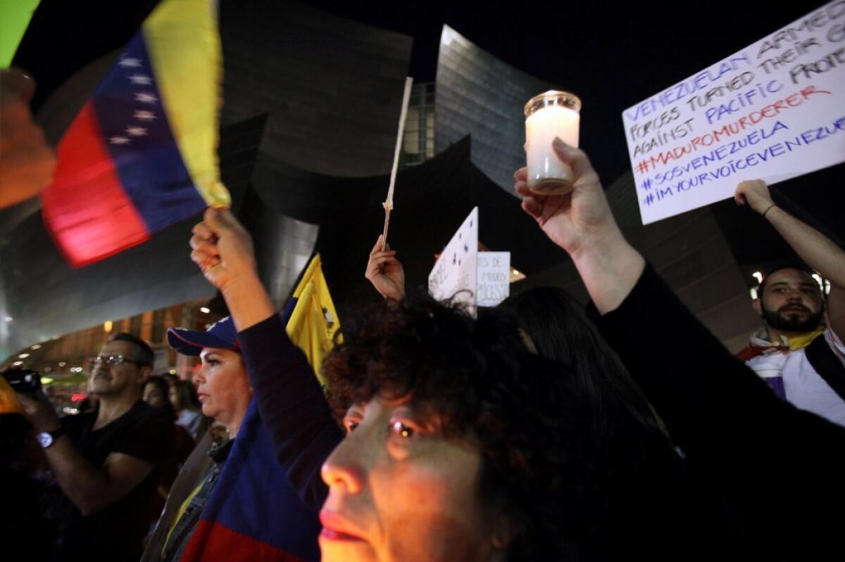 Demonstrators gathered Friday outside Disney Hall to hold a vigil for Venezuela, the native country of L.A. Phil conductor Gustavo Dudamel.