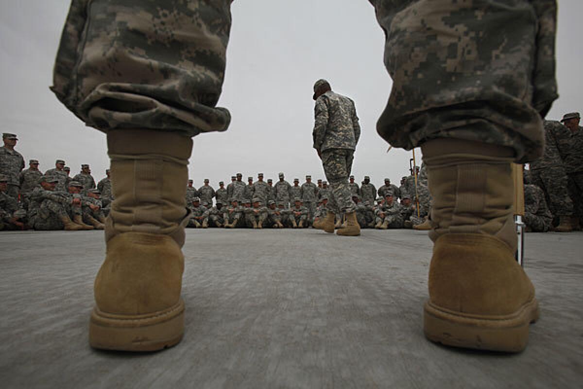 The U.S. military has more than 90 different mental health programs. These soldiers are listening to information on suicide prevention in 2013.