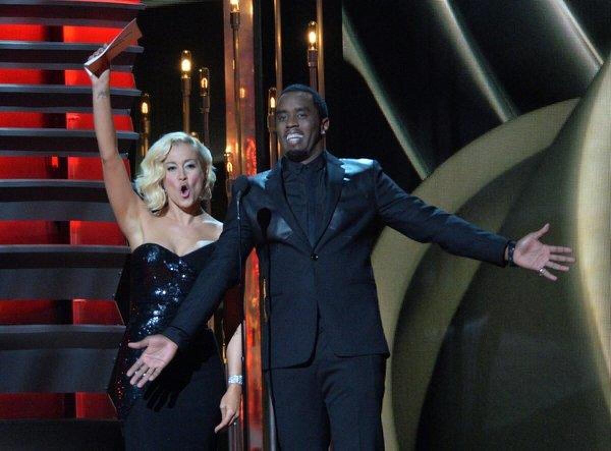 Kellie Pickler, shown with co-presenter Sean Combs during the 47th annual CMA Awards in Nashville, has released her fourth album, "The Woman I Am."