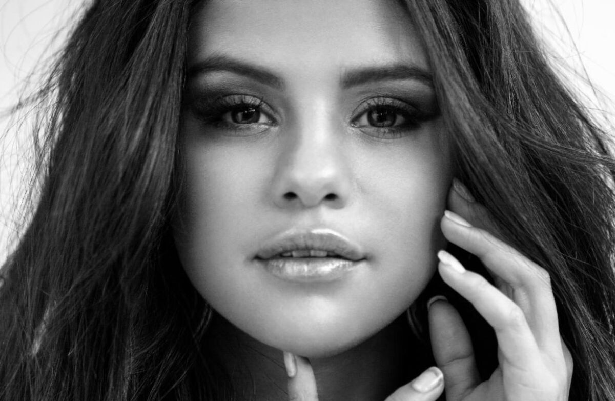 A black-and-white closeup of Selena Gomez's face