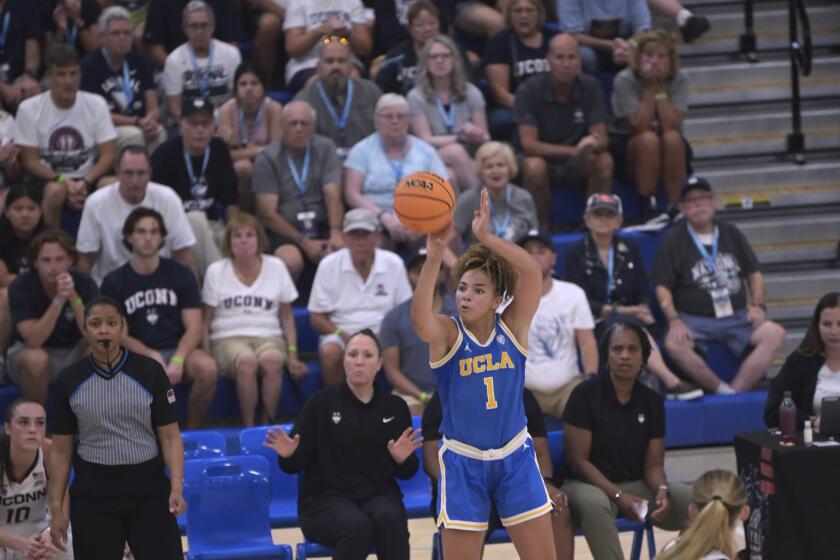 UCLA's Kiki Rice shoots against UConn during the Cayman Islands Classic in George Town, Cayman Islands