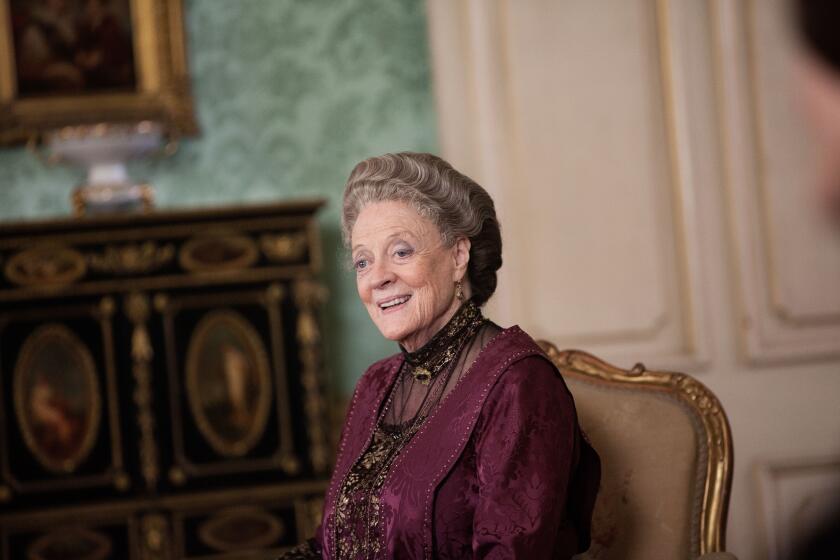 Maggie Smith as Violet Crawley, Dowager Countess of Grantham, during filming of Season 3 of the hit period drama "Downton Abbey." Here's a look back at the British actress' lengthy career.