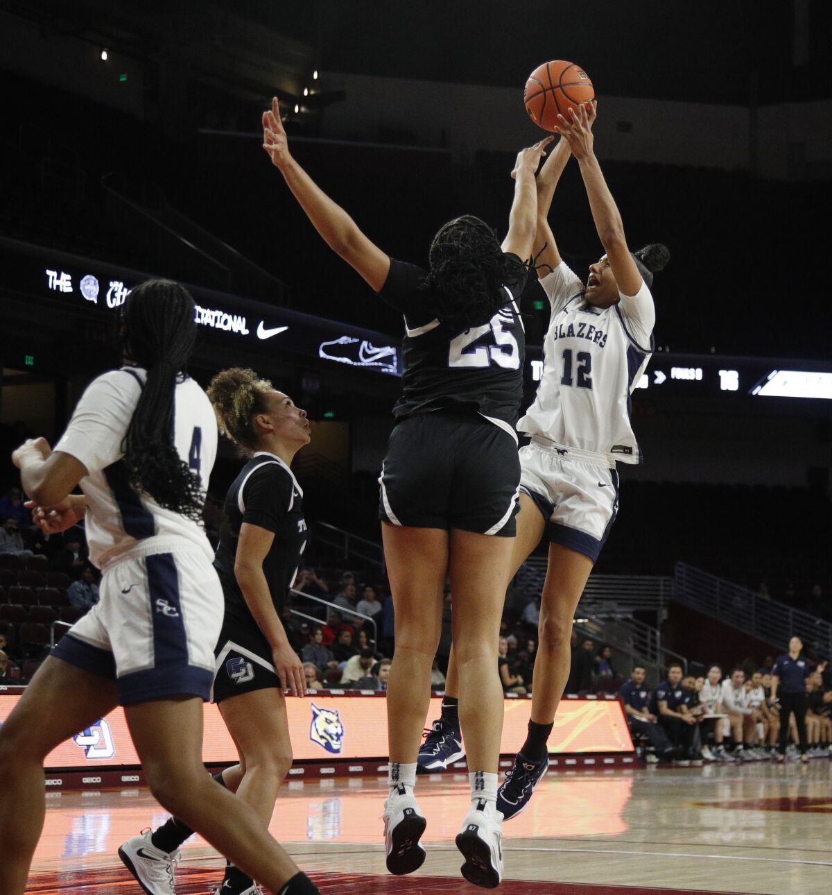 Sierra Canyon's Juju Watkins shoots over La Jolla Country Day's Brea Cunningham during the Chosen 1's Invitational.