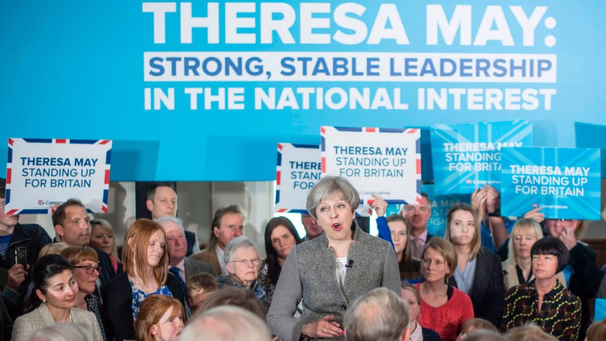 Britain's Prime Minister Theresa May speaks to supporters in the village of Banchory, in Aberdeenshire, northeastern Scotland, on April 29, 2017, during a general election campaign visit.