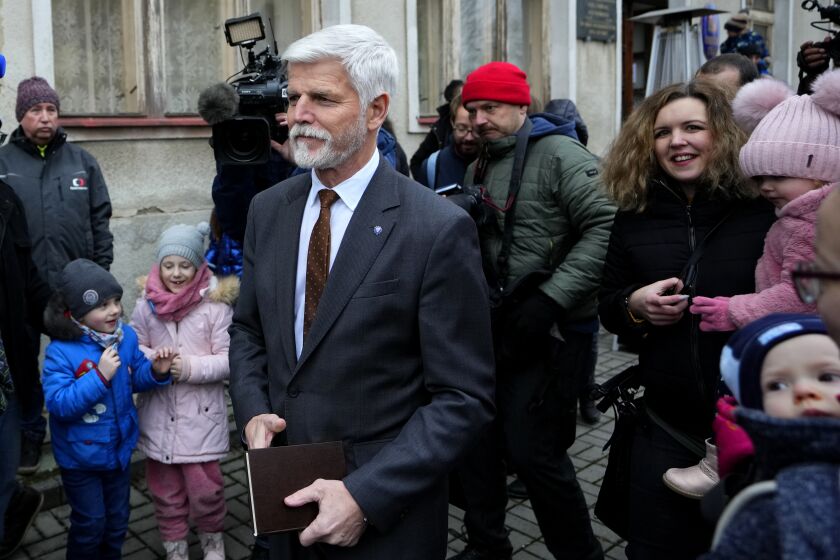 Presidential candidate and retired army Gen. Petr Pavel leaves the polling station after casting his vote during presidential election runoff in Cernoucek, Czech Republic, Friday, Jan. 27, 2023. (AP Photo/Petr David Josek)