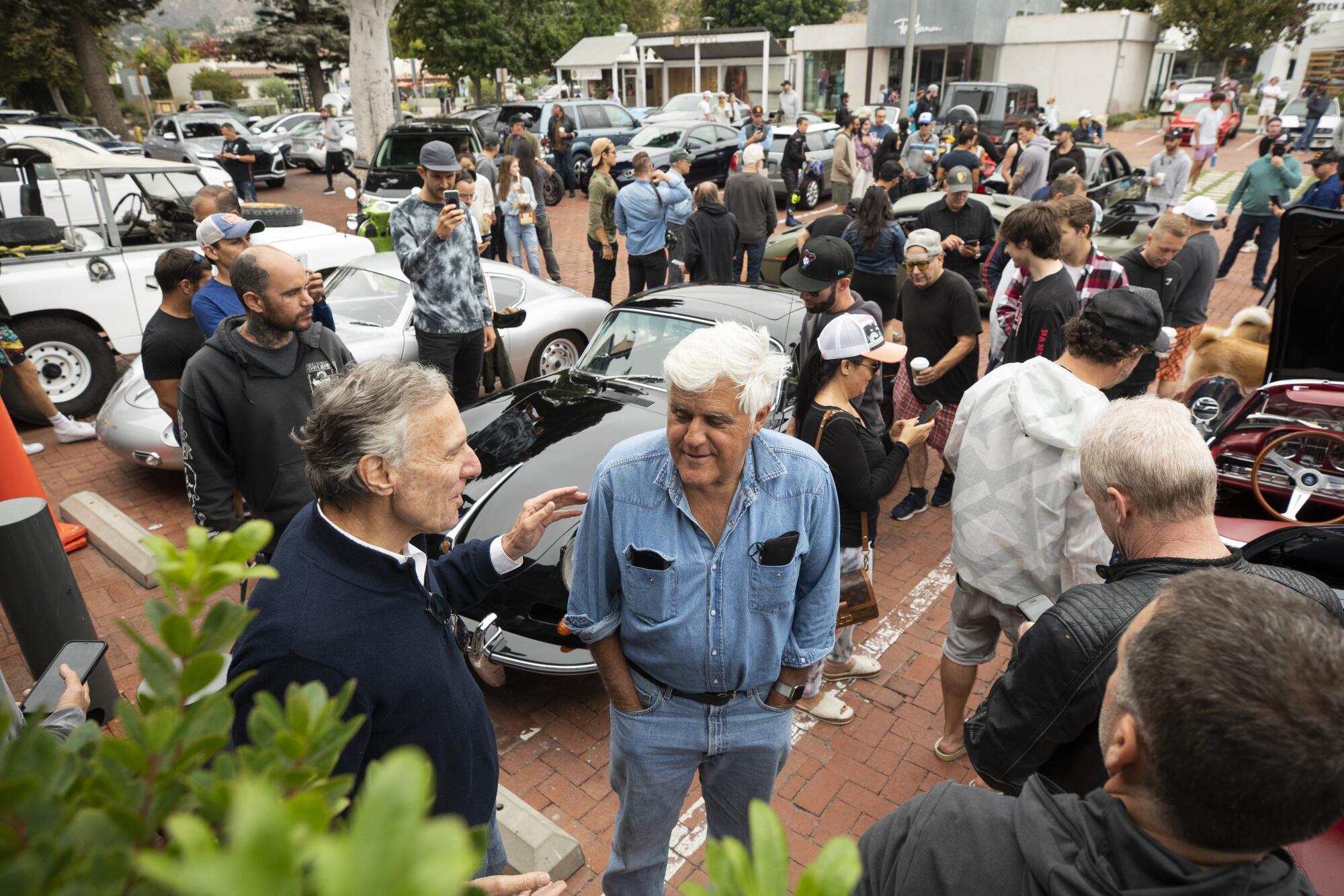 Bruce Meyer, left, chats with Jay Leno chat at the Malibu Country Market.