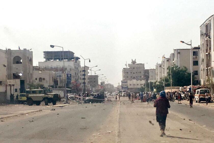 Security forces gather at the site of a deadly attack in Aden, Yemen, on Thursday.
