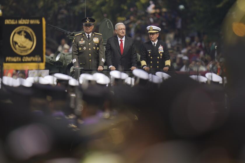 Mexican President Andrés Manuel López Obrador, center, rides with Defense Secretary Luis Cresencio Sandoval, left, and Navy Secretary Rafael Ojeda Durán to review the troops before the start of the annual Independence Day parade in the main square, the Zocalo, in Mexico City, Monday, Sept. 16, 2024. (AP Photo/Felix Marquez)