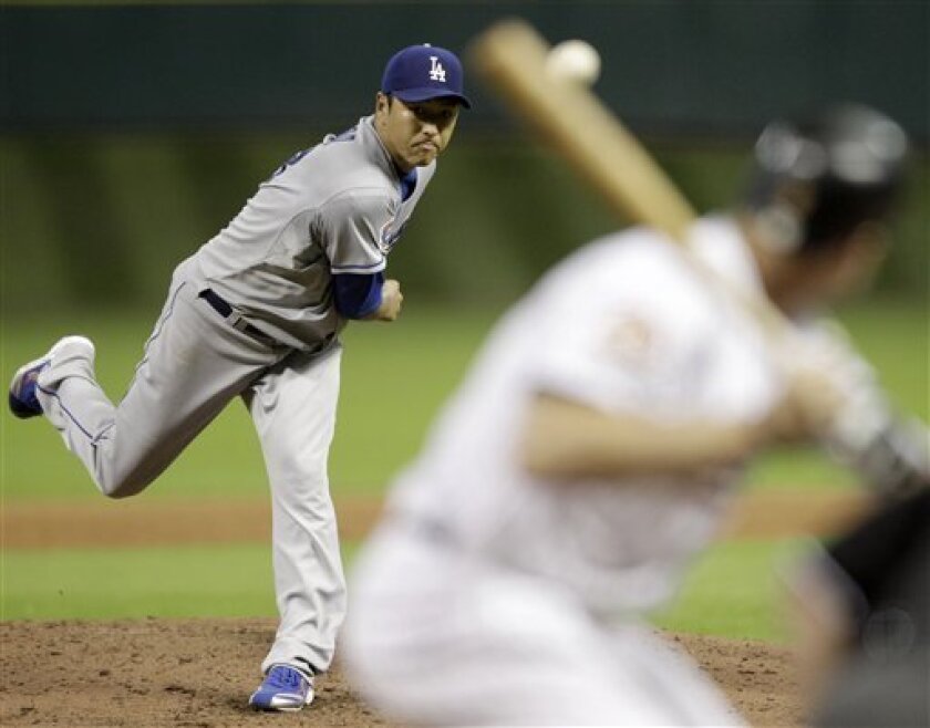 Los Angeles Dodgers' Hiroki Kuroda, left, delivers a pitch to Houston Astros' Hunter Pence, right, during the fourth inning of a baseball game Friday, Sept. 10, 2010, in Houston. (AP Photo/David J. Phillip)