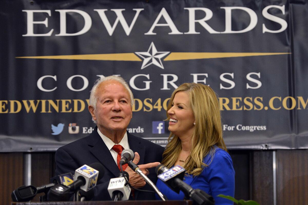 Former Louisiana Gov. Edwin Edwards and his wife, Trina, smiling at a political event in 2014.