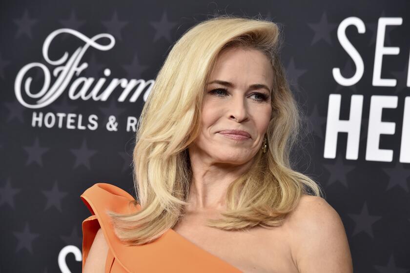 Chelsea Handler in a one-shoulder orange dress