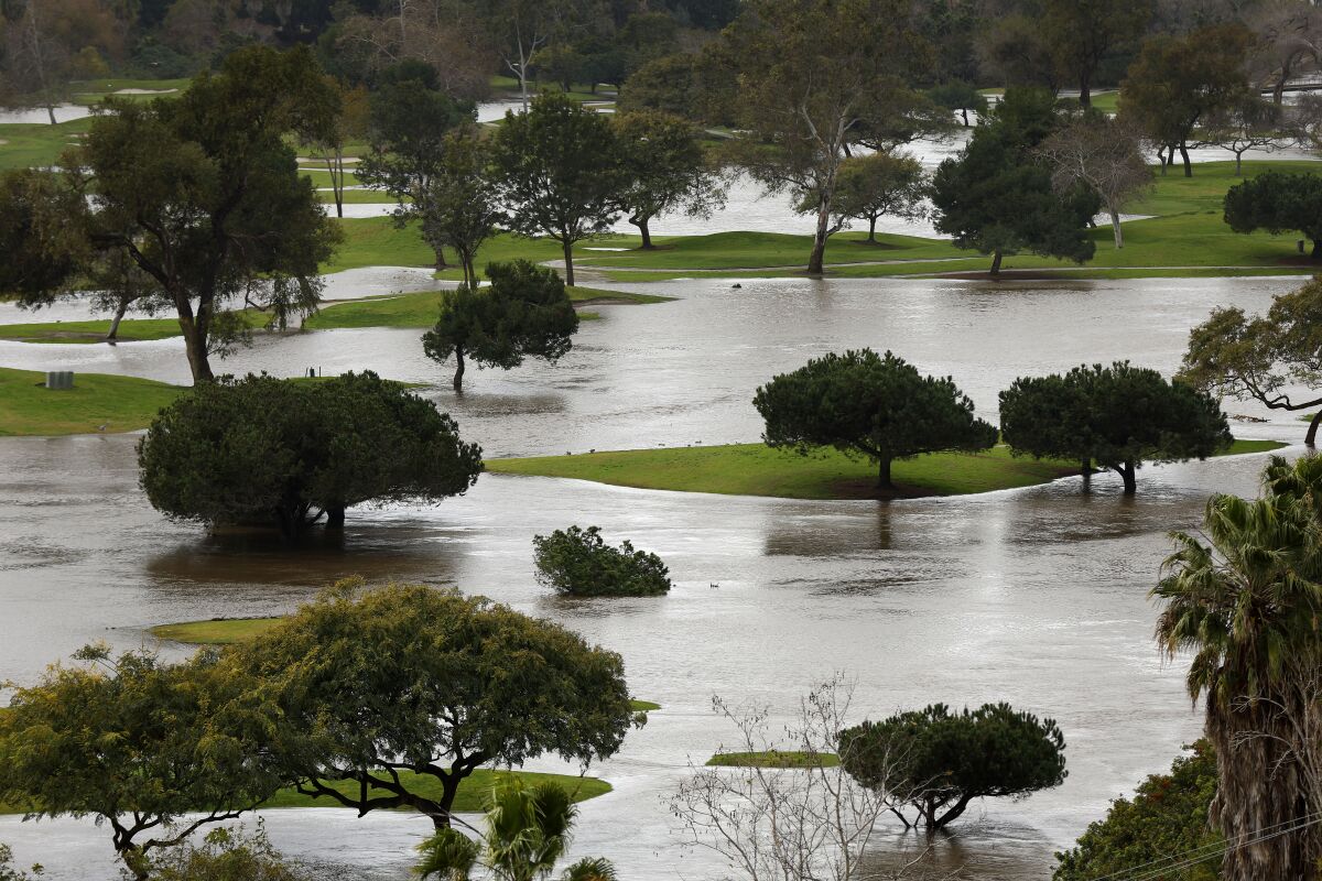 The San Diego River overflowed into the Riverwalk Golf Club in Mission Valley