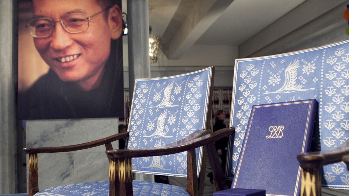 An empty chair in Oslo symbolizing Nobel Peace Prize winner Liu Xiaobo's absence from the ceremony in which he was to be awarded a diploma and medal. The diploma rests on the chair.