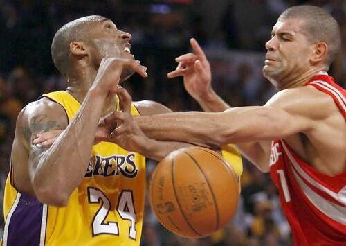 Rockets forward Shane Battier strips the ball from Lakers guard Kobe Bryant in the second half Monday night.