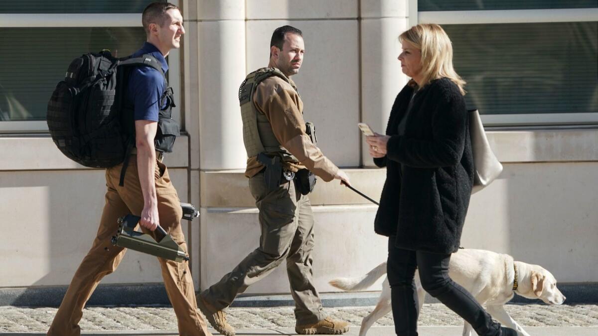 Security personnel patrol outside the federal courthouse in Brooklyn on Monday during the trial of Joaquin "El Chapo" Guzman.