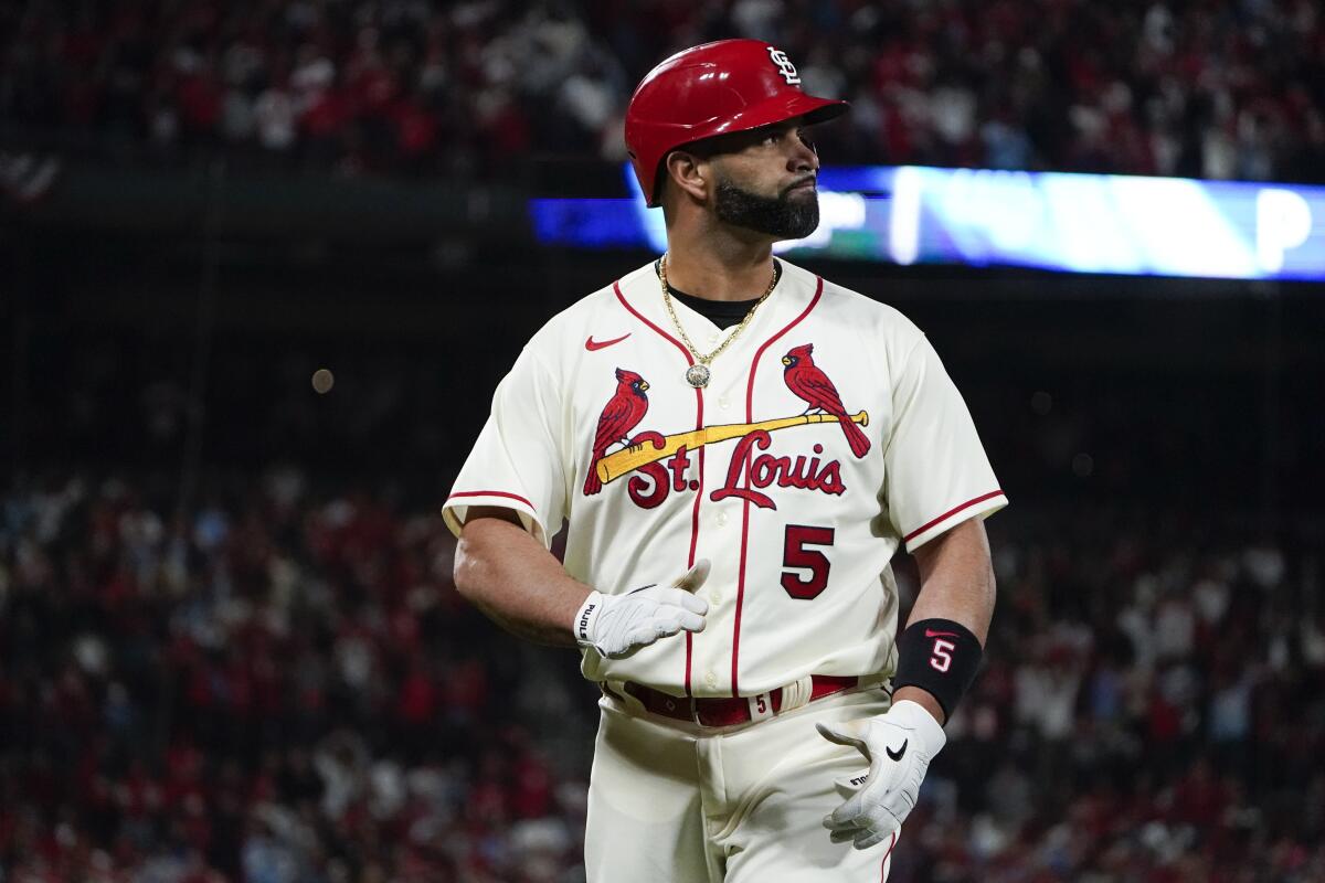 Albert Pujols looks at the scoreboard after being replaced by a pinch runner.