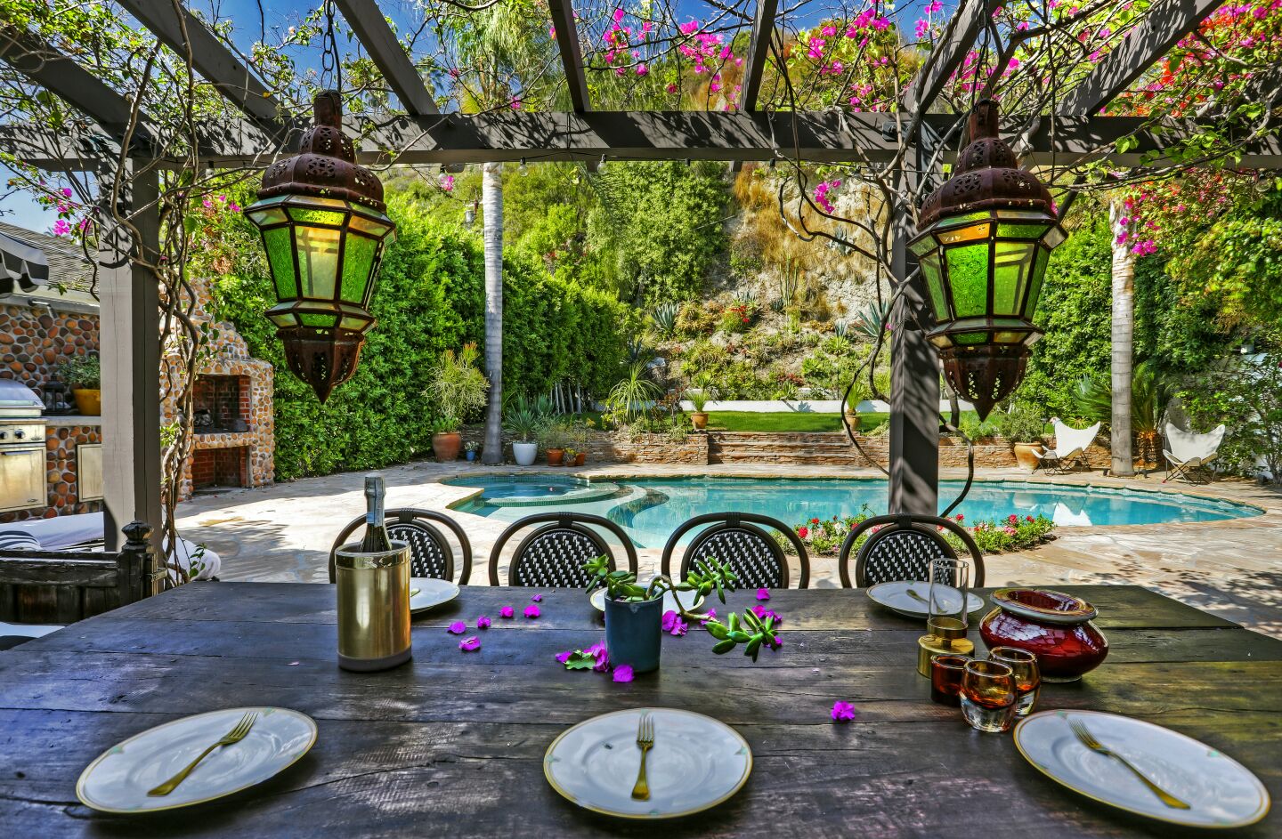 French doors open onto a dining patio in the backyard.