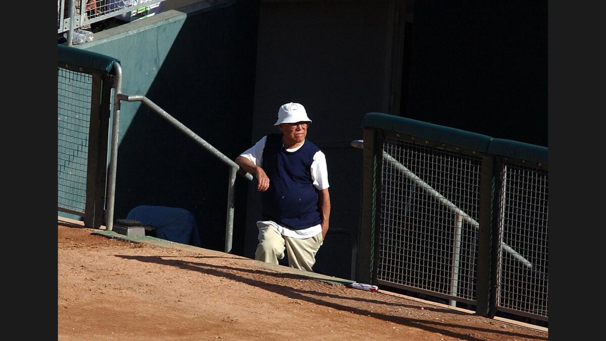 Yosh Kawano in the dugout in 2002. He retired from the Cubs in 2008, when he was 87.