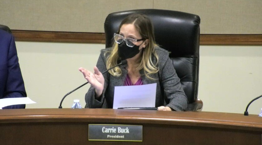 PYLUSD board president Carrie Buck explains the indoor mask requirement at a Jan. 11 meeting before adjourning.