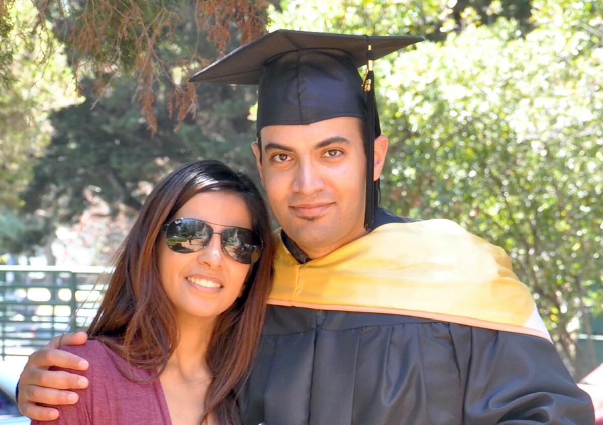 In this photo provided by the family of Abdulrahman al-Sadhan, Abdulrahman al-Sadhan poses with his sister Areej Al Sadhan for a graduation photo, at Notre Dame de Namur University, a private Catholic university, in Belmont, California, May 4, 2013. A court in Saudi Arabia has upheld a verdict that sentences the Saudi aid worker who criticized the government on Twitter to 20 years in prison and an additional 20-year travel ban after his release, drawing criticism from the Biden administration on Wednesday, Oct. 6, 2021. (Family of Abdulrahman al-Sadhan via AP)